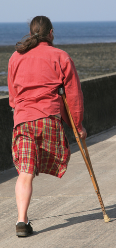 A man using a crutch.
